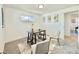 Well-lit office with light colors, neutral walls, and cozy rugs, with decorative artwork at 8873 Princeton St, Westminster, CO 80031
