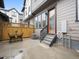 Private backyard featuring a patio area, wood fence, and convenient access stairs at 5148 Taft Ct, Wheat Ridge, CO 80033