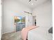 Bedroom with a large TV, carpet flooring, and a glimpse into an attached bathroom at 5148 Taft Ct, Wheat Ridge, CO 80033