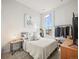 Serene bedroom with a comfortable bed, stylish decor, a large window and closet at 5148 Taft Ct, Wheat Ridge, CO 80033