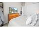 Comfortable bedroom featuring a bed, a TV, and closet with sliding doors at 5148 Taft Ct, Wheat Ridge, CO 80033