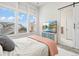 Well-lit bedroom with large windows, carpet flooring, and a view of the neighborhood at 5148 Taft Ct, Wheat Ridge, CO 80033