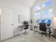 Bright office featuring large windows, vaulted ceilings, desk with computer setup and chair at 5148 Taft Ct, Wheat Ridge, CO 80033