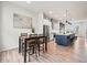 Spacious open-concept layout with a dining area, kitchen, and living space, perfect for entertaining at 5148 Taft Ct, Wheat Ridge, CO 80033