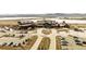 Aerial view of a golf course and recreation facility surrounded by trees at 2794 Heron Lakes Pkwy, Berthoud, CO 80513