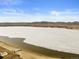 Scenic aerial view showcasing a lake and mountain range at 2794 Heron Lakes Pkwy, Berthoud, CO 80513