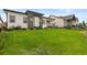 Expansive backyard with verdant lawn, stylish architecture, and fenced perimeter at 2794 Heron Lakes Pkwy, Berthoud, CO 80513