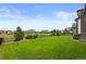 Expansive backyard with green grass, perfect for outdoor activities and relaxation at 2794 Heron Lakes Pkwy, Berthoud, CO 80513