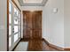 Welcoming entryway with hardwood floors and decorative double doors at 2794 Heron Lakes Pkwy, Berthoud, CO 80513