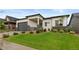 Charming single-story home features a well-manicured lawn and stone accents at 2794 Heron Lakes Pkwy, Berthoud, CO 80513