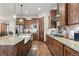 Well-equipped kitchen featuring a farmhouse sink, granite countertops, and ample cabinet space at 2794 Heron Lakes Pkwy, Berthoud, CO 80513