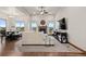 Inviting living room featuring a fireplace, large windows, and comfortable seating at 2794 Heron Lakes Pkwy, Berthoud, CO 80513