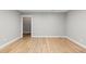Living room with wood floors and white trim at 2794 Heron Lakes Pkwy, Berthoud, CO 80513