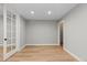 Living room with wood floors and white trim at 2794 Heron Lakes Pkwy, Berthoud, CO 80513