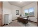 Bright office space with large window, desk, and a view at 2794 Heron Lakes Pkwy, Berthoud, CO 80513