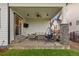 Covered patio featuring an outdoor seating area, ceiling fan, and mounted television at 2794 Heron Lakes Pkwy, Berthoud, CO 80513