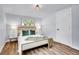 Comfortable bedroom featuring hardwood floors, ample natural light at 5152 Bryant St, Denver, CO 80221
