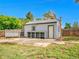 Detached garage features a basketball hoop, open storage, and a service door at 5152 Bryant St, Denver, CO 80221