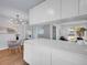 Open-concept kitchen featuring white cabinets, quartz countertops, and stainless steel appliances at 5152 Bryant St, Denver, CO 80221