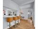 Stylish kitchen featuring bar seating, stainless steel appliances, and an open layout at 5152 Bryant St, Denver, CO 80221
