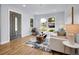 Bright living room with stylish furniture, wood floors, large windows, and modern decor at 5152 Bryant St, Denver, CO 80221