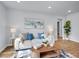 Cozy living room with bright lighting, stylish decor, and an open floor plan at 5152 Bryant St, Denver, CO 80221