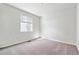 Clean bedroom featuring a window with natural light and neutral carpeting at 1397 Brookfield Pl, Erie, CO 80026