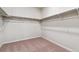 Well-organized walk-in closet with shelving and rods for ample storage space at 1397 Brookfield Pl, Erie, CO 80026