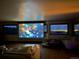 Finished basement featuring a large projection screen and comfortable seating area at 393 Dixon Rd, Boulder, CO 80302
