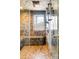 Walk-in shower featuring decorative tilework, a built-in bench, and a window with scenic views at 393 Dixon Rd, Boulder, CO 80302