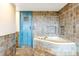 Bathroom featuring mosaic tile and a blue door at 393 Dixon Rd, Boulder, CO 80302