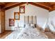 Cozy bedroom featuring a decorative headboard, colorful stained glass windows, and plush carpeting at 393 Dixon Rd, Boulder, CO 80302