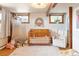 Charming Bedroom with wooden crib, white shag rug, and whimsical decor under a warm light fixture at 393 Dixon Rd, Boulder, CO 80302