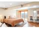 Bright bedroom with sliding doors to a balcony featuring scenic mountain views and modern furnishings at 393 Dixon Rd, Boulder, CO 80302