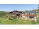 Beautiful home exterior with multi-level deck overlooking a landscaped yard at 393 Dixon Rd, Boulder, CO 80302