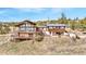 Stunning multi-story home featuring a combination of wood and stucco and multiple decks with a mountain view at 393 Dixon Rd, Boulder, CO 80302