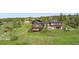 Stunning multi-level home on a hill with balconies and lush greenery at 393 Dixon Rd, Boulder, CO 80302