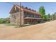 Classic log cabin exterior with spacious front porch offering mountain charm at 393 Dixon Rd, Boulder, CO 80302
