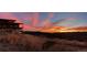 Home exterior view showcasing sunset, architecture, and natural hillside landscape at 393 Dixon Rd, Boulder, CO 80302