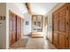 Bright foyer featuring tile flooring, wooden doors, and an inviting entrance to the living spaces at 393 Dixon Rd, Boulder, CO 80302