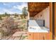 Relaxing hot tub area with views of the surrounding landscape and mature trees at 393 Dixon Rd, Boulder, CO 80302