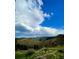 Picturesque landscape with a rainbow, scenic mountains, and lush meadows at 393 Dixon Rd, Boulder, CO 80302