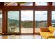 Bright living room featuring sliding glass doors out to a deck with stunning mountain views at 393 Dixon Rd, Boulder, CO 80302