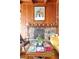 Cozy living room featuring a stone fireplace, wood paneling, and stylish decor at 393 Dixon Rd, Boulder, CO 80302