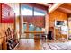 Bright office space with a wall of windows, hardwood floors, and a guitar collection at 393 Dixon Rd, Boulder, CO 80302