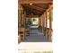 Inviting porch featuring wooden columns and rocking chairs, perfect for relaxation at 393 Dixon Rd, Boulder, CO 80302