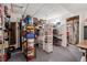 Basement providing ample storage space with shelving and a doorway to additional utility areas at 13668 Plaster Cir, Broomfield, CO 80023