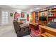 Finished basement offering a comfortable living space with built-in shelving and cozy seating at 13668 Plaster Cir, Broomfield, CO 80023