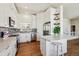 Bright kitchen with white cabinets, stainless steel appliances, and a stylish backsplash at 13668 Plaster Cir, Broomfield, CO 80023