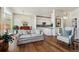 Open living area with hardwood floors, dining space, and a modern kitchen at 13668 Plaster Cir, Broomfield, CO 80023